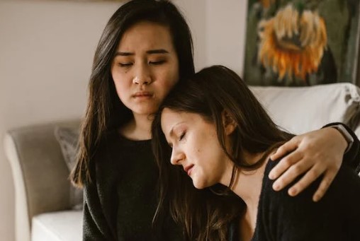 Women Comforting Each Other
